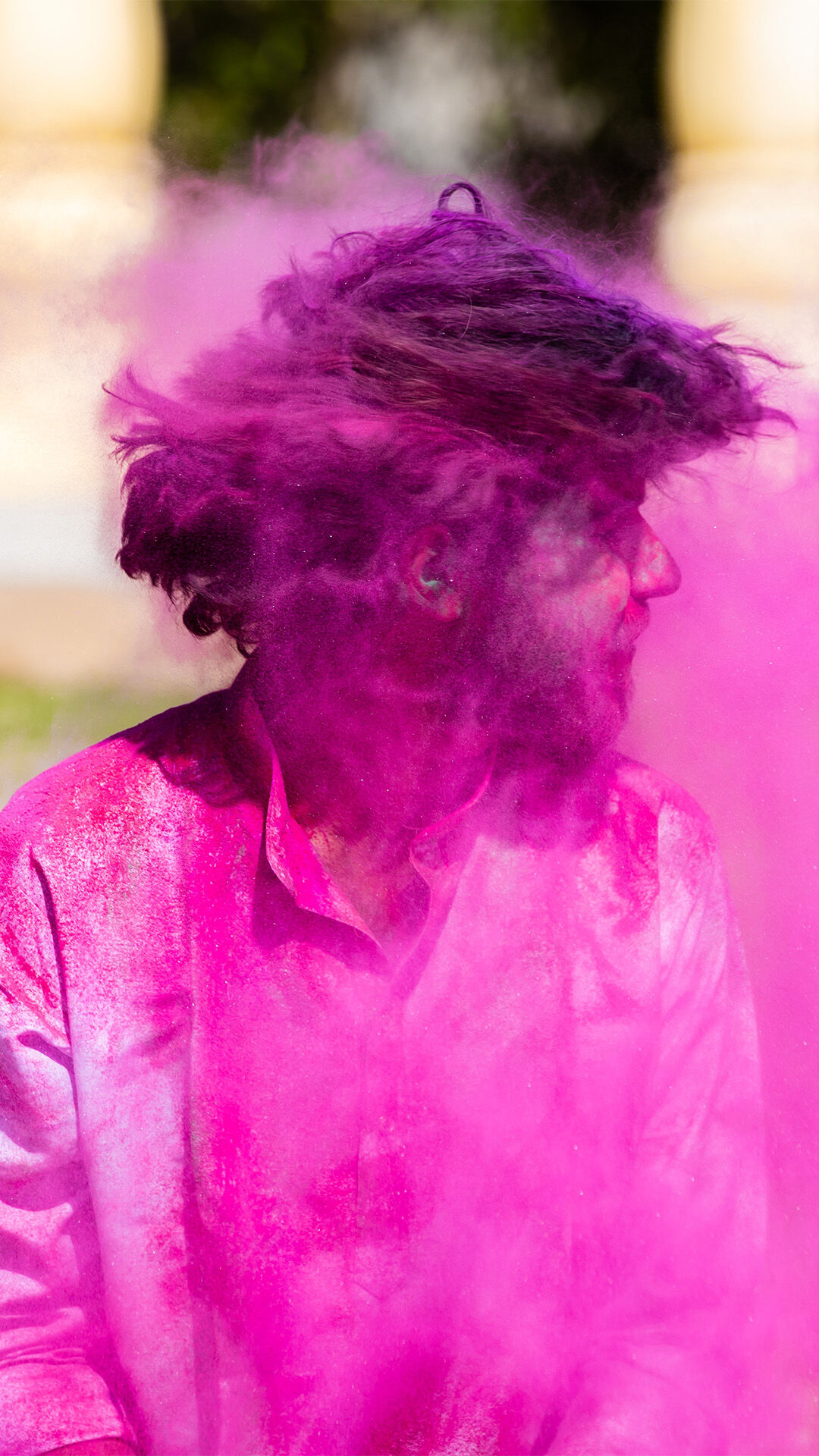 A man with pink colour on his hair